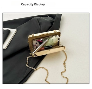 Capacity of metallic gold clutch bag showing phone and cosmetics with chain strap