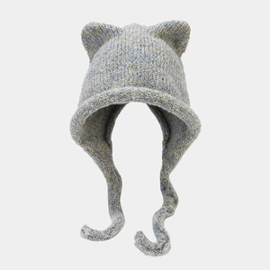 Detail of multi-color thick knit beanie with cat ears and braided tassels