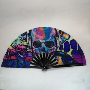 Detail of bamboo kung fu fan featuring a colorful graffiti skull and headphones print