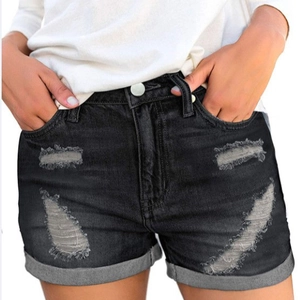 Women's black high-waisted denim shorts with ripped details and rolled cuffs on white background