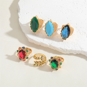 Close-up of vintage gold rings set with marquise and oval colorful cubic zirconia