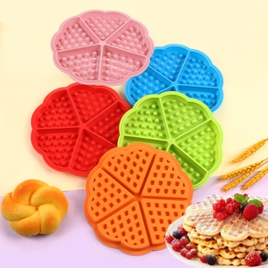 Top view of five colorful silicone waffle molds in heart-shaped floral designs