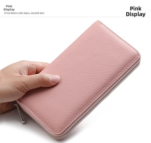 Pink lychee texture leather wallet close-up featuring secure silver metal zipper