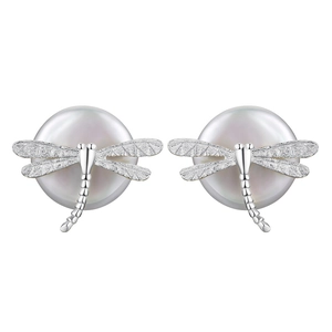 Detail showing textured silver dragonfly wings and round white pearls on earrings