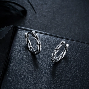 Retro twisted titanium steel hoop earrings with woven texture in a polished silver finish