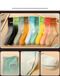 Detail view of gradient cotton socks with AURORA embroidery and ribbed knit texture