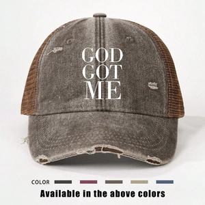 Detailed view of distressed trucker hat with GOD GOT ME print and color options