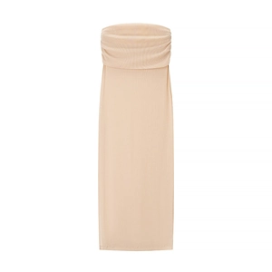 Detail view of the smocked bodice and textured fabric on this beige tube midi dress
