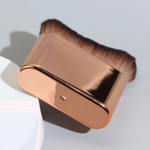 Flat foundation brush with rose gold metal handle and dark brown gradient soft bristles