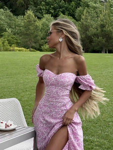 Detail of pink floral dress with off-shoulder neckline and detachable puff sleeves