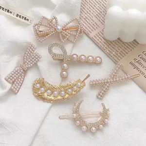 Elegant gold pearl rhinestone hair clip set with butterfly and moon designs on magazine
