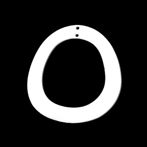 Macro detail of irregular circular stainless steel pendant with two small holes for DIY jewelry
