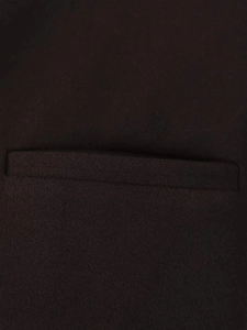 Detailed macro view of the wool fabric texture and fine stitching on the jacket pocket