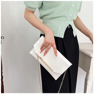 Elegant white envelope clutch with gold chain strap and metallic trim detail