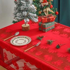Red Christmas lace tablecloth featuring festive hollow patterns of trees and snowflakes