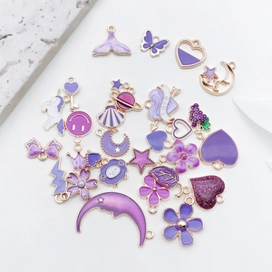 Selection of purple enamel alloy charms in heart, star, and moon shapes for DIY jewelry
