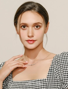 Close-up of S925 silver star necklace with turquoise pendant on woman neck