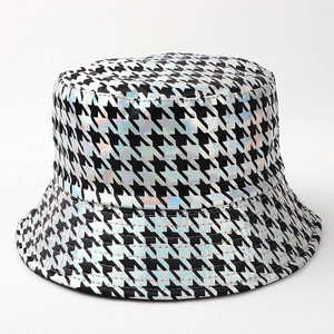 Close-up detail of iridescent houndstooth bucket hat with metallic rainbow finish