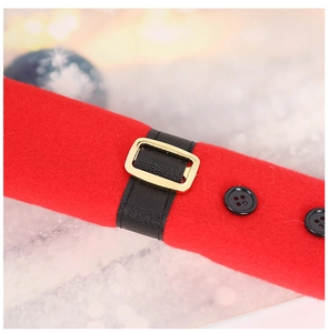 Close-up of red Christmas fridge handle cover with black belt and golden buckle detail