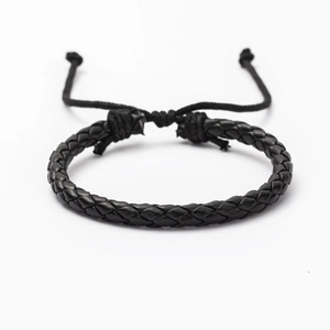 Detail view of the black braided leather bracelet with adjustable sliding knot closure