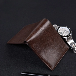 Men's short bifold leather wallet in dark brown with professional textured finish