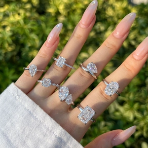 Elegant S925 sterling silver rings with pear and emerald cut zircons on a hand