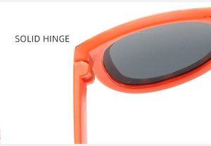 Detailed close-up of a sturdy solid hinge on orange plastic sunglasses for kids