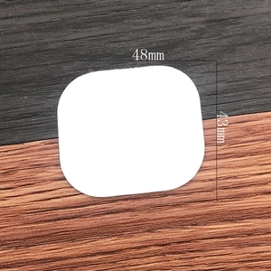 Detailed view of white rounded square glass mirror lens measuring 48mm by 43mm