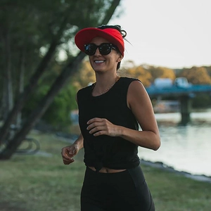 Close-up of a red open-top sun hat for women during outdoor running and camping