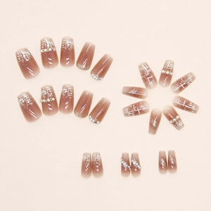 Brown gradient press-on nails with pearl accents and white plaid pattern in ballet style