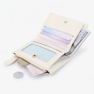 Compact cream leather wallet featuring multiple card slots and a secure zipper pocket