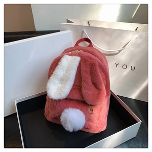 Pink plush rabbit backpack in a white gift box with a thank you paper bag decoration