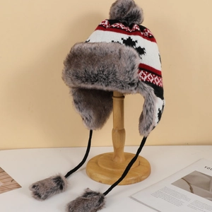 Detail shot of winter trapper hat with leopard maple leaf pattern and faux fur lining