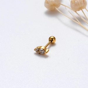 Detailed view of a gold screw-back stud earring featuring marquise and round cubic zirconia