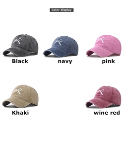 Detailed grid of embroidered bow baseball caps in black, navy, pink, khaki, and wine red