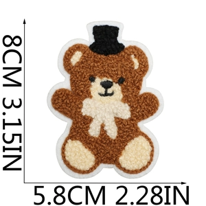 Brown teddy bear towel embroidery patch with size dimensions 8cm by 5.8cm in a macro view