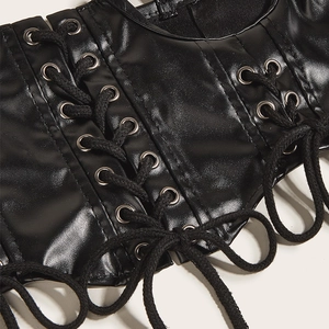 Close-up of black PU leather waist corset with lace-up metal eyelets and detailed texture