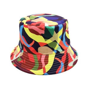 Detailed view of the colorful abstract graffiti print on a stylish sun bucket hat