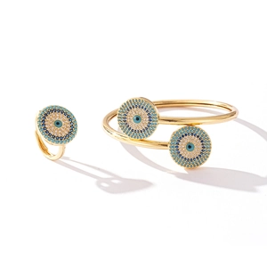 Golden bridal jewelry set featuring an evil eye bangle and matching ring with zircon stones