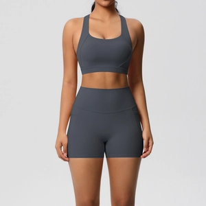 Detail view of high-support sports bra and high-waisted shorts with side pockets