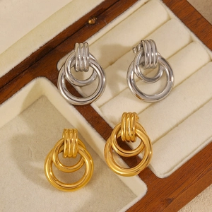 Elegant two-tone 18k gold and silver stainless steel interlocking hoop earrings in a box