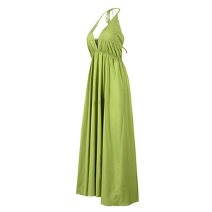 Side view of backless halter maxi dress in grass green with pleated waist detail