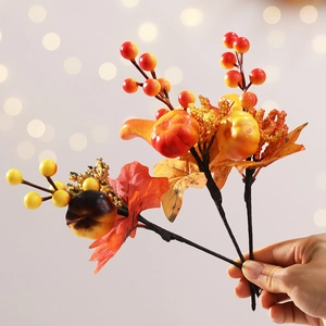 High-quality Halloween bouquet with autumn maple leaves, berries and small orange pumpkins