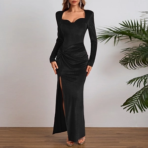 Detail of elegant black velvet dress showing square neckline and thigh-high side slit