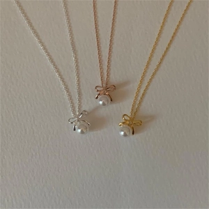 Elegant 925 sterling silver bow pearl necklaces in silver, gold, and rose gold finishes