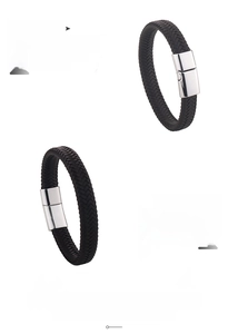 Detail of black braided leather men's bracelet with silver magnetic alloy clasp