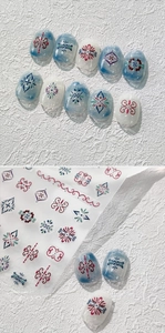 Close-up of 5D embossed nail stickers featuring intricate Persian totem floral designs