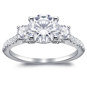 Three-stone round zirconia wedding ring with pavé side stones on a silver band
