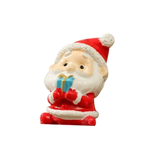 Miniature Christmas Santa Claus resin figurine holding blue gift box home decor