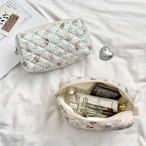 Detailed internal storage of quilted cotton bag with cute bunny and bear prints